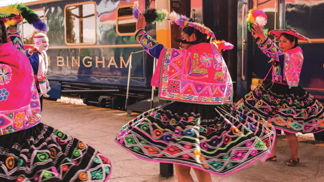 Dancers give the Belmond Hiram Bingham train a colourful send-off.
